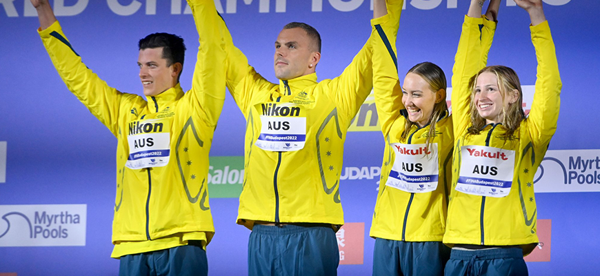 Jack Cartwright, Kyle Chalmers, Madi Wilson and Mollie O’Callaghan celebrate on the podium