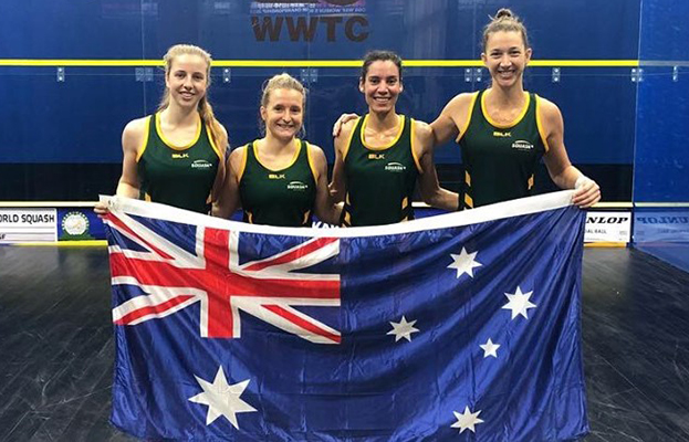 Alex Haydon Hockey standing holding Australian Flag with other athletes