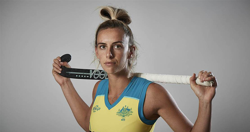 Gabi Nance holding hockey stick
