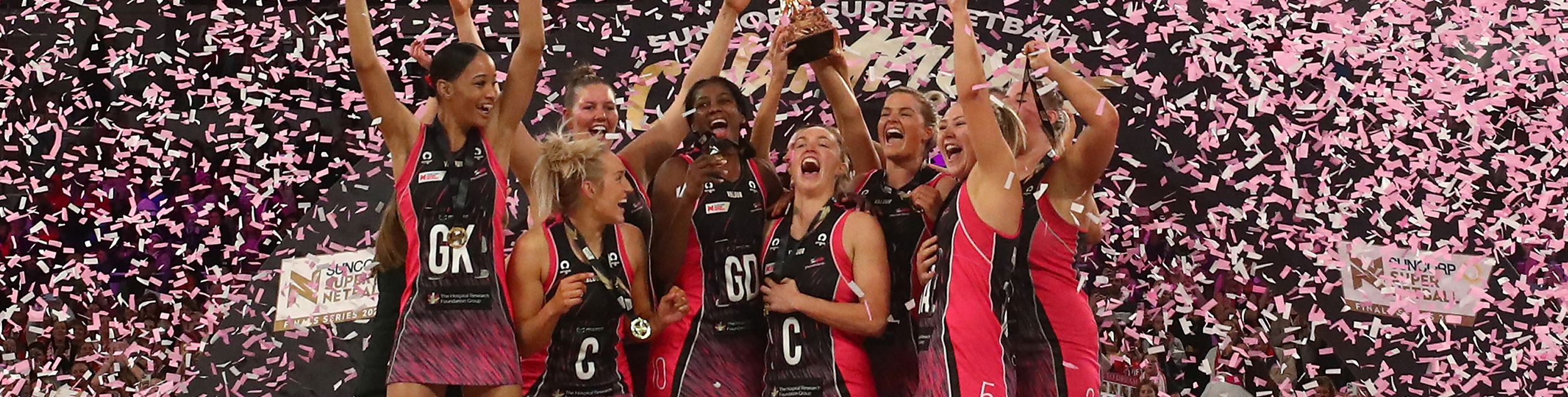 Adelaide Thunderbirds players celebrating with confetti falling around them