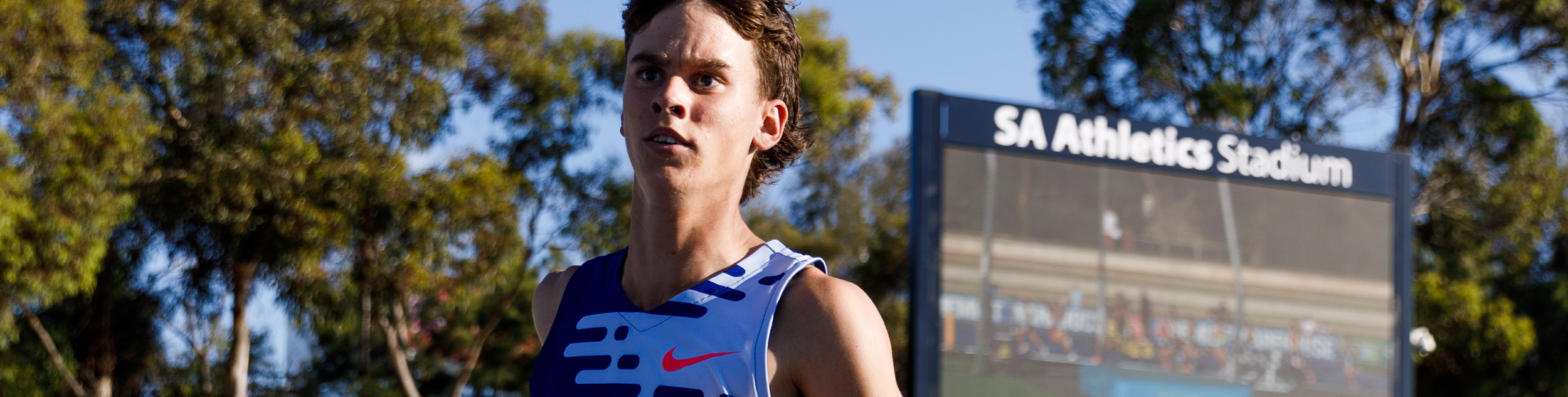 Angus Hincksman running on a track