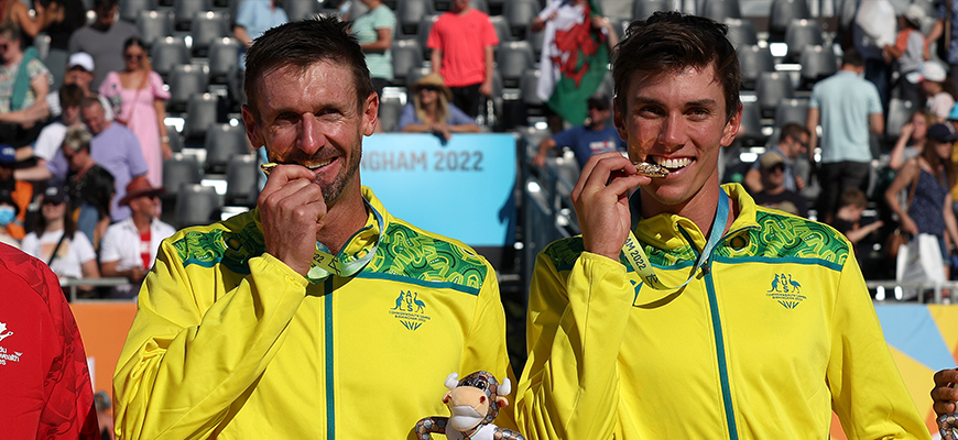 Two Mens Vollyball players with medals