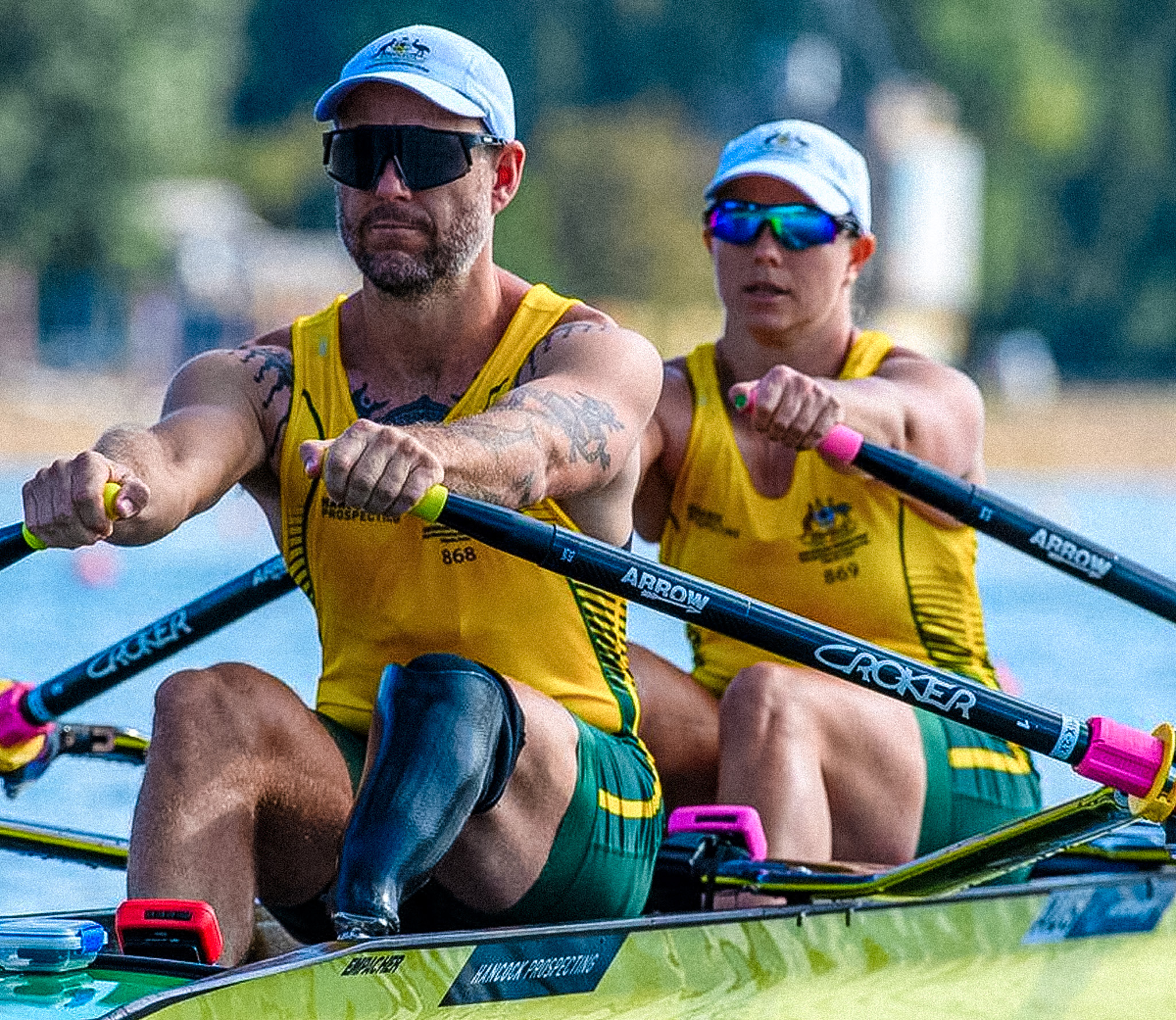 two para athletes rowing in Australian uniform