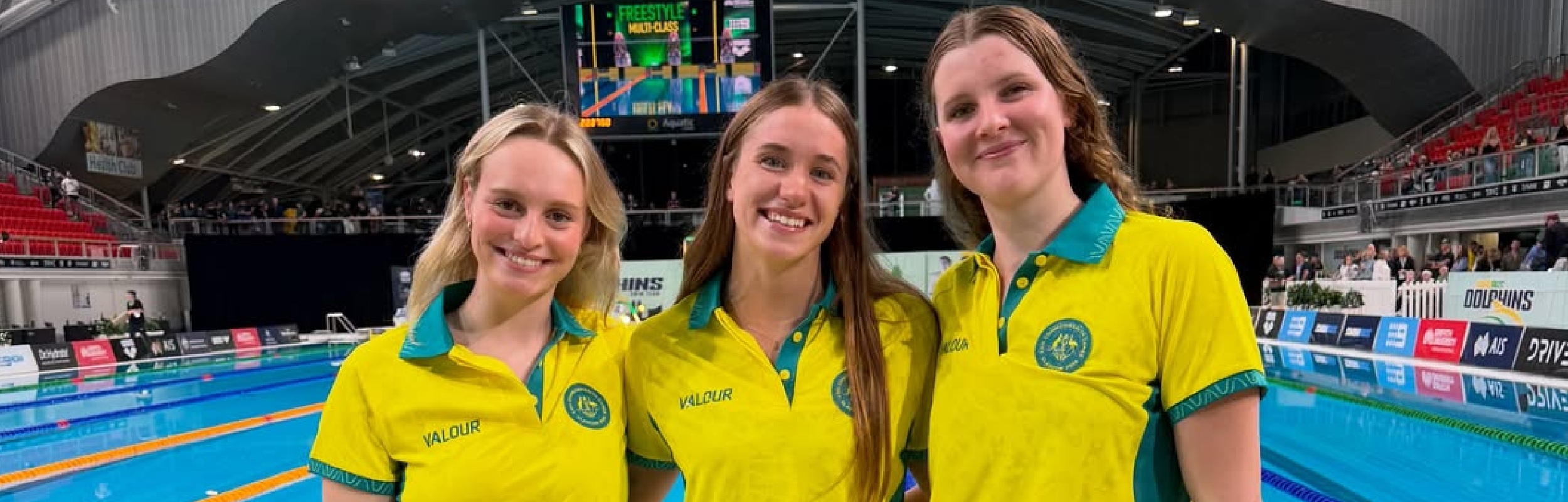 3 Australian swimmers in front of pool
