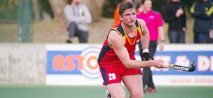 Lachie Busiko playing field hockey