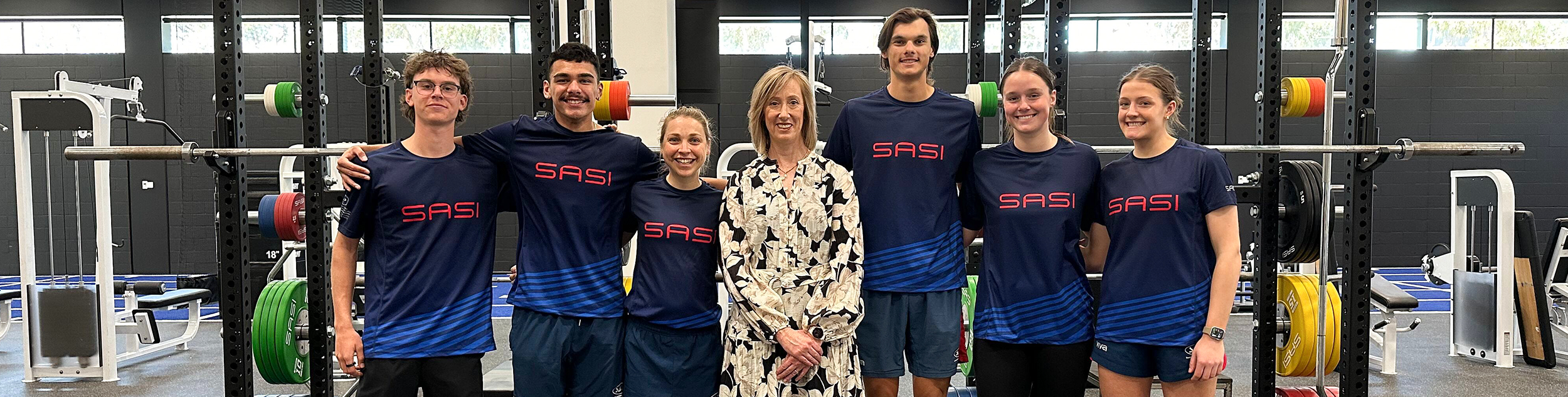SASI athletes standing with Keren Faulkner