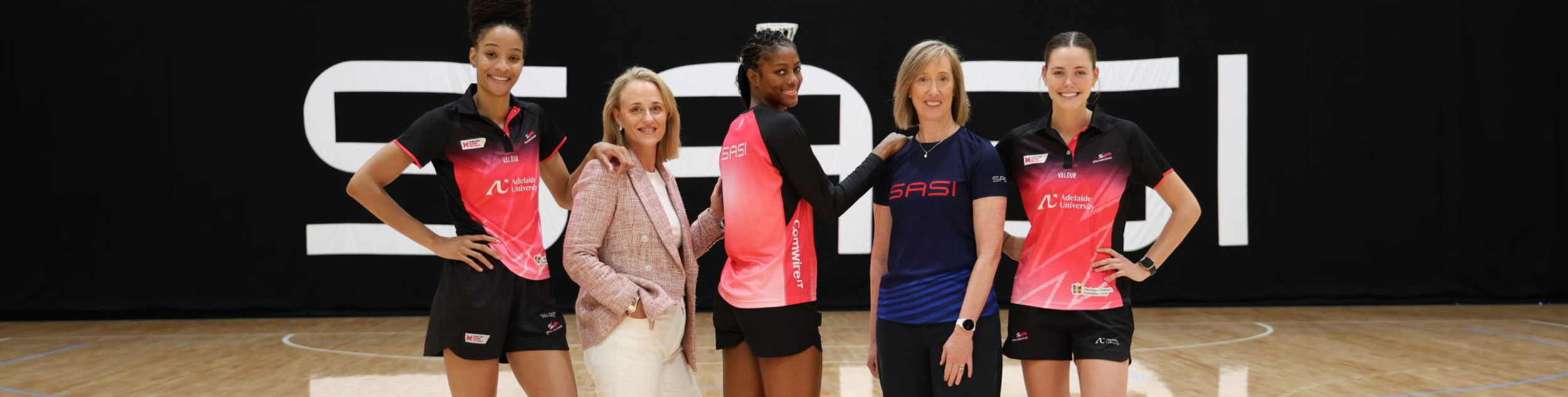 Thunderbirds athletes stading on the court with Bronwyn Klei and Keren Faulkner