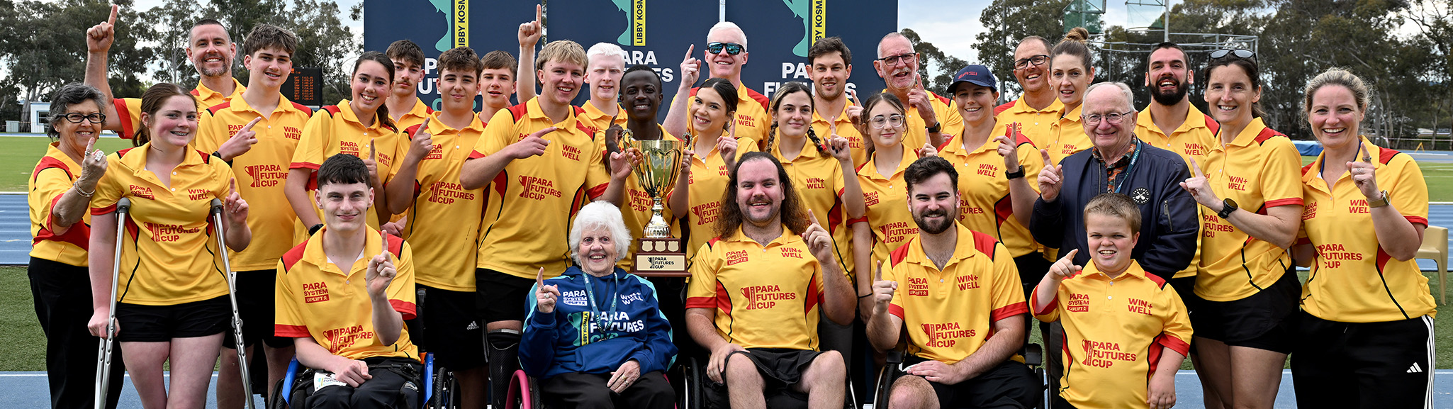 Team West celebrates with Libby Kosmala and the trophy